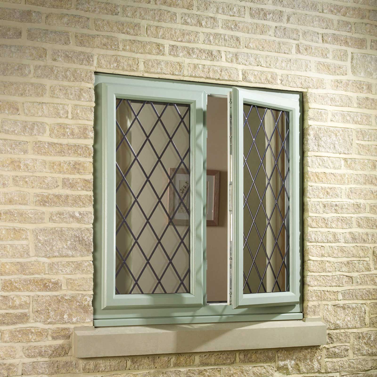 Green uPVC windows for a home in Worcester.